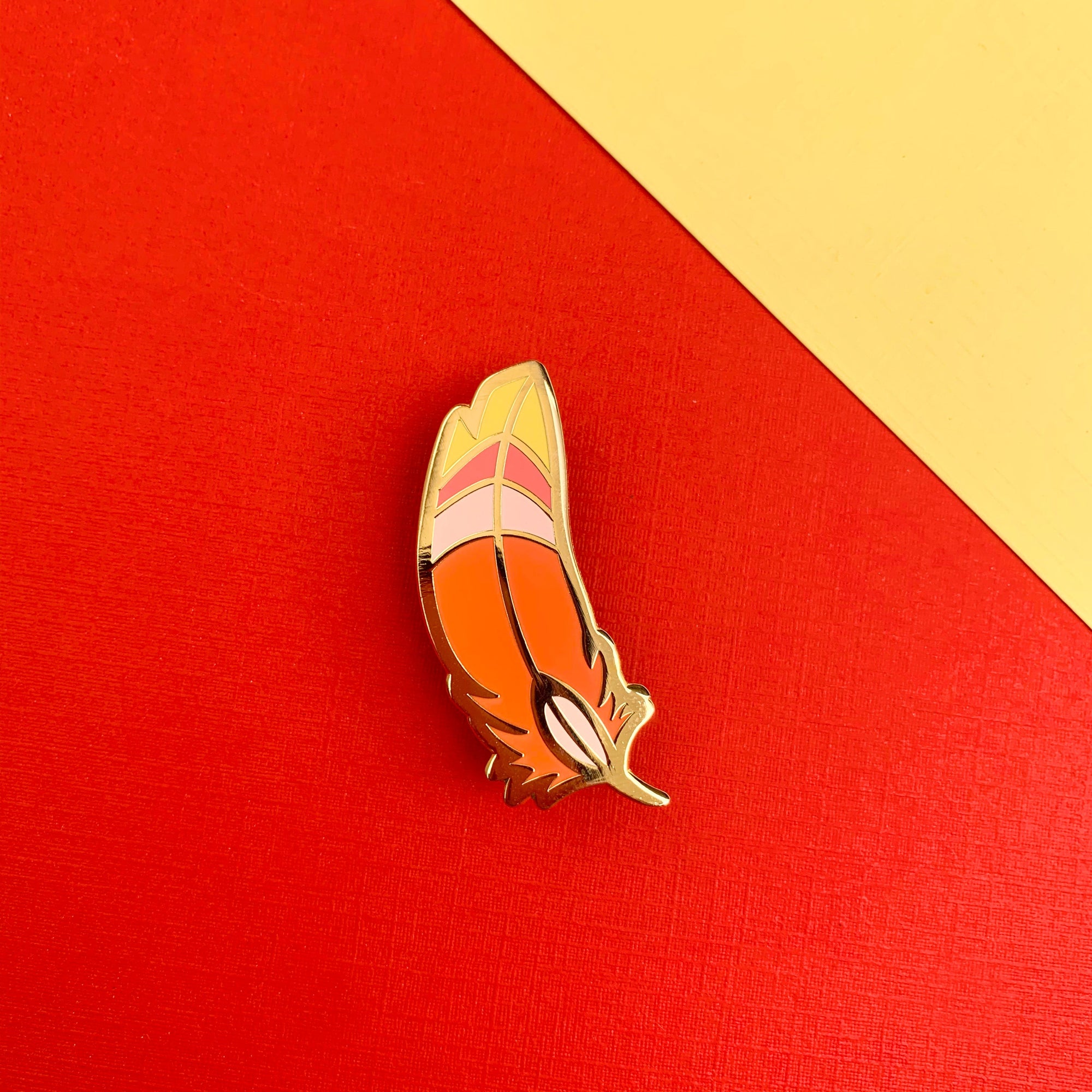 Crimson Loftwing Feather Enamel Pin by Shumi Collective